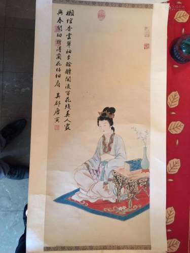 Peinture illustrant une dame de qualité assise dans une attitude méditative près de sa tablette de lettré.