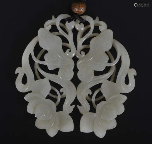 Two Chinese carved jade pendants of lotus