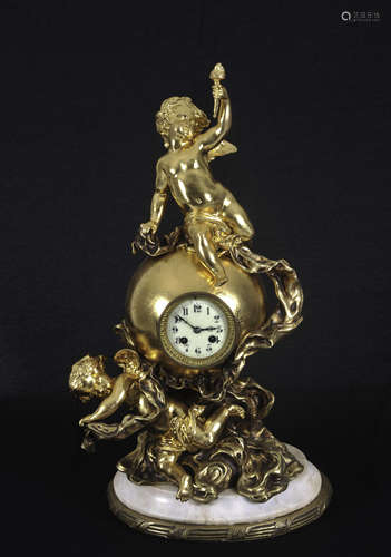 Gilt clock decorated with cherubs