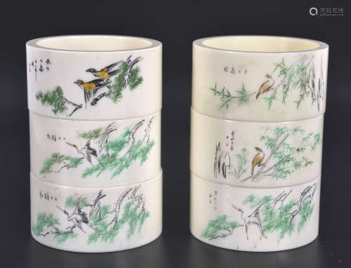 Set of six bone napkin rings painted with birds