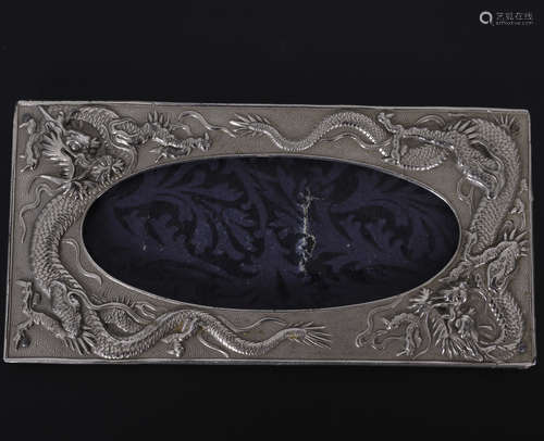 silver photo frame decorated in relief with dragons