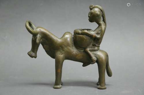 African Bronze Carving of a Man Riding a Bull