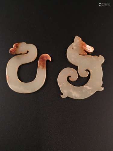 A Pair of Han Dynasty Dragon Pendants