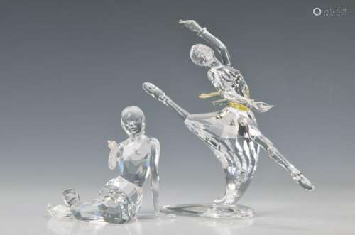 two crystal figurines