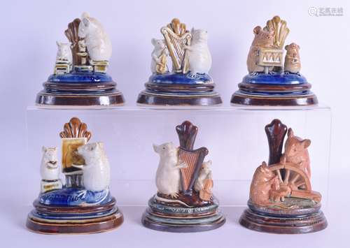 A FINE AND EXTREMELY RARE SET OF SIX DOULTON LAMBETH MENU HOLDERS by George Tinworth, each