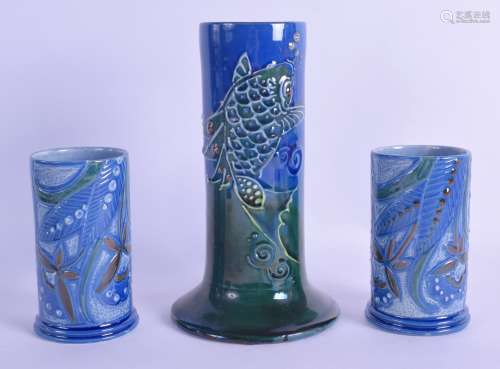 A PAIR OF ART NOUVEAU BRANNAM POTTERY CYLINDRICAL SPILL VASES together with a larger spill vase.