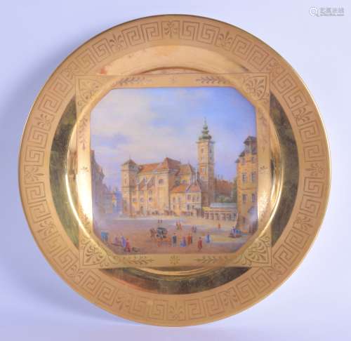 A LATE 19TH CENTURY AUSTRIAN VIENNA PORCELAIN CABINET PLATE painted with a view of a town. 24 cm
