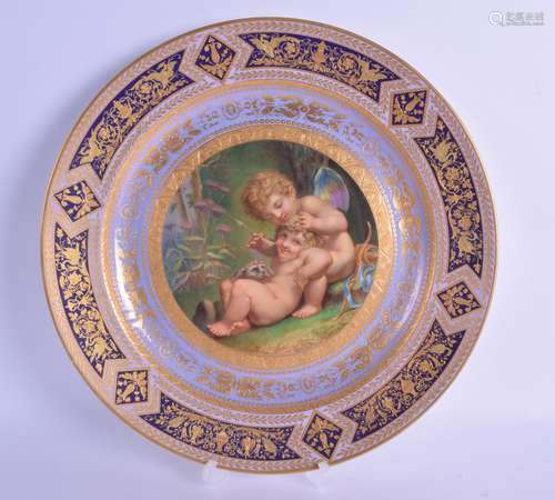 A FINE LARGE VIENNA PORCELAIN CABINET PLATE painted with two putti and a hound by A Beer, within a