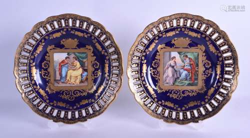 A PAIR OF LATE 19TH CENTURY AUSTRIAN VIENNA PORCELAIN RETICULATED PLATES painted with panels of