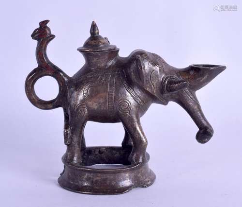 A RARE 12TH CENTURY PERSIAN OIL LAMP in the form of an elephant, Khurusan, the hinged top opening to