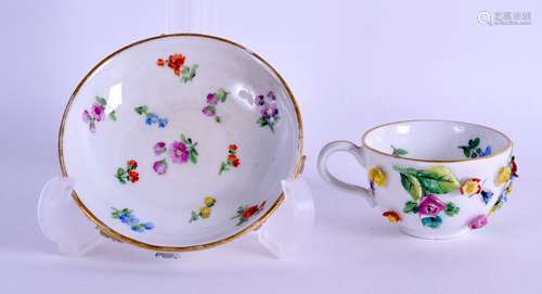 19th c. Meissen miniature floral encrusted teacup and saucer painted with flowers.