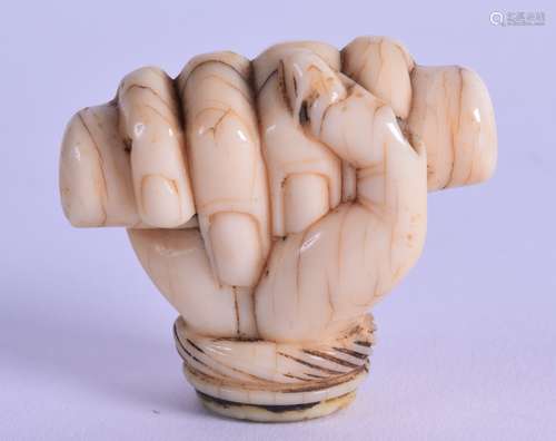 A GOOD 18TH CENTURY CARVED IVORY FIST CANE HANDLE naturalistically modelled. 5 cm x 4 cm.