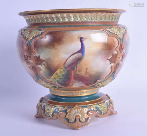 A ROYAL WORCESTER HADLEY WARE PIERCED BOWL painted with a bird standing within a landscape. 17 cm