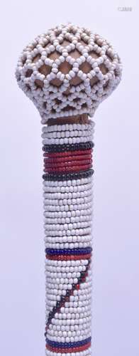 AN AFRICAN TRIBAL MASAI RUNGU STICK with bead work mounts. 65 cm long.