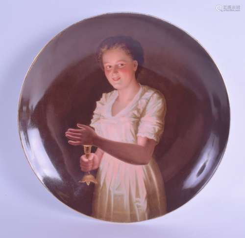 A LATE 19TH CENTURY VIENNA PORCELAIN PLATE painted with a young female holding a candle within an