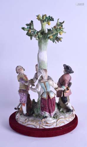 A 19TH CENTURY MEISSEN PORCELAIN FIGURAL GROUP depicting four figures dancing around a tree,