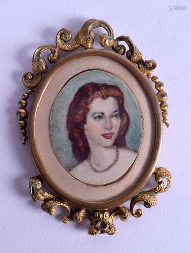 A LATE 19TH/20TH CENTURY CONTINENTAL PAINTED IVORY PORTRAIT MINIATURE depicting a female wearing a