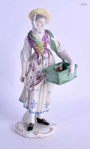 Ludwigsburg figure of a female street vendor carry her ware in a carton with straps over her