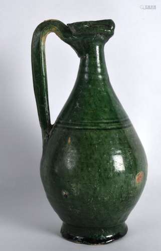 A PERSIAN GREEN GLAZED JUG 9th/10th Century, with high loop handle and incised banding, together