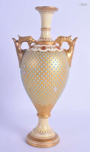 A COALPORT JEWELLED PORCELAIN TWIN HANDLED VASE painted with gilt motifs. 22 cm high.