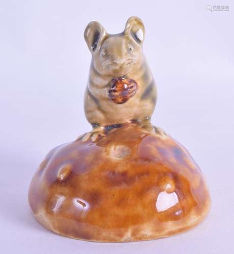 A RARE DOULTON LAMBETH FIGURAL GROUP by George Tinworth, modelled as a mouse clutching a nut. 6.5 cm