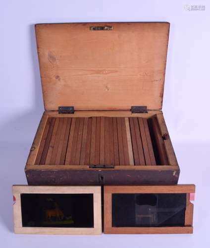 A GROUP OF TWENTY SEVEN VICTORIAN MAGIC LANTERN SLIDES contained within a wooden box, mainly