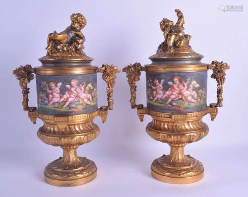 A FINE PAIR OF 19TH CENTURY FRENCH ORMOLU TWIN HANDLED VASES AND COVERS the central body formed from