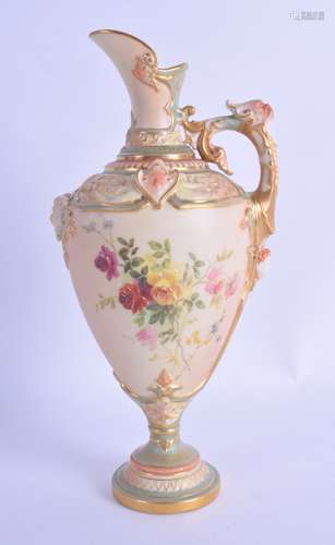 A ROYAL WORCESTER BLUSH IVORY PORCELAIN EWER painted with flowers and mask heads. 23.5 cm high.