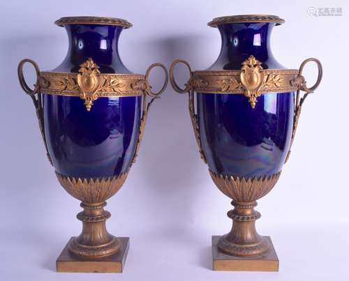 A LARGE PAIR OF 19TH CENTURY FRENCH PARIS PORCELAIN TWIN HANDLED VASES with ormolu mounts,