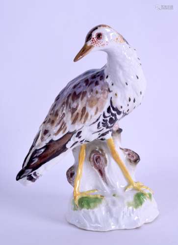A 19TH CENTURY MEISSEN PORCELAIN FIGURE OF A BIRD modelled in purple enamels upon a naturalistic