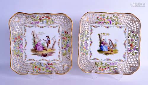 A LARGE PAIR OF LATE 19TH CENTURY GERMAN DRESDEN PORCELAIN RETICULATED DISHES painted with