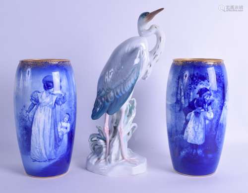 A PAIR OF ROYAL DOULTON BLUE AND WHITE VASES printed with figures within landscapes, together with a