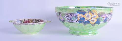 A MALING LUSTRE TWIN HANDLED BOWL together with a larger bowl. 15 cm & 21 cm diameter. (2)