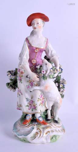 18th c. Derby figure of a woman with a sheep on a rococo base. 20 cm high.