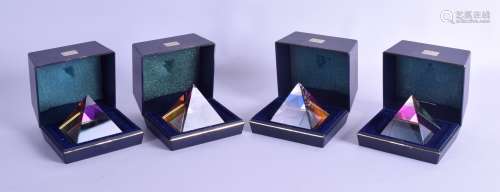 AN UNUSUAL SET OF FOUR BOXED STAMP PAPERWEIGHTS in the shape of pyramids. 6 cm wide. (4)