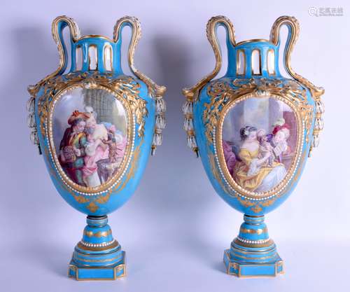 A LARGE PAIR OF 19TH CENTURY FRENCH SEVRES TWIN HANDLED VASES finely painted with panels of