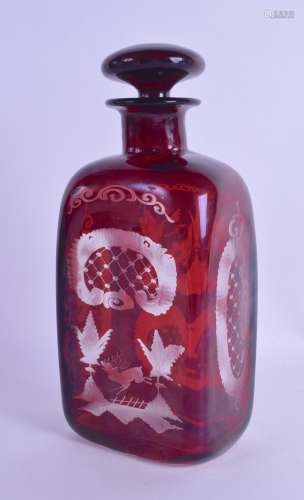 A BOHEMIAN RUBY GLASS DECANTER AND STOPPER engraved with landscapes and animals. 22.5 cm high.