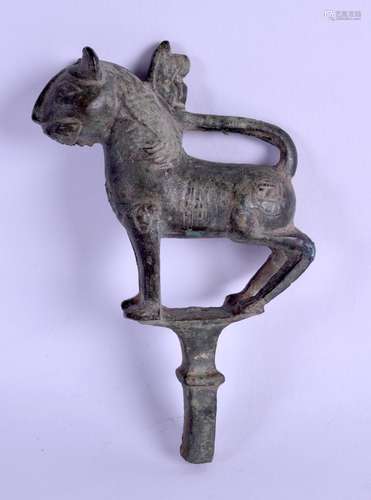 A 14TH CENTURY PERSIAN BRONZE FINIAL in the form of a standing beast. 13.5 cm long.