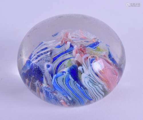 AN ANTIQUE GLASS PAPERWEIGHT decorated with multi coloured canes. 7 cm diameter.