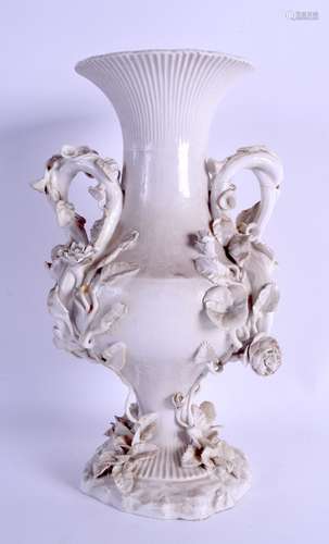 A LARGE 19TH CENTURY FRENCH TWIN HANDLED BLANC DE CHINE VASE encrusted and overlaid with flowers and