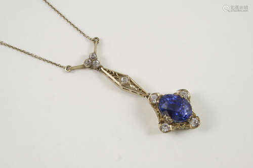 A SAPPHIRE PENDANT the oval-shaped sapphire is set within an openwork surround mounted with circular