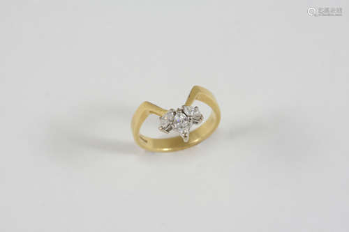 A DIAMOND V-SHAPED RING set with three marquise-cut diamonds in 18ct. gold. Size L.