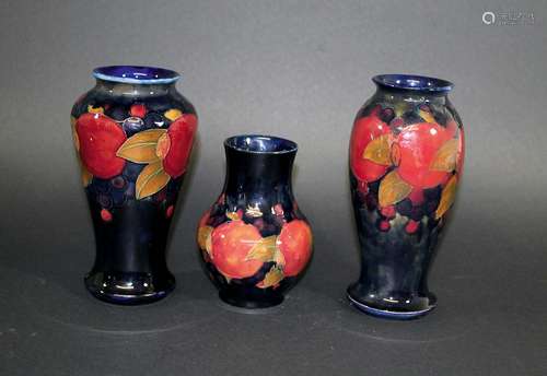 MOORCROFT VASES three Moorcroft vases in the Pomegranate design, the largest vase with