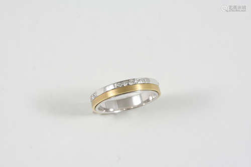 AN 18CT. TWO COLOUR GOLD AND DIAMOND SWIVEL RING set with circular-cut diamonds. Size M 1/2.