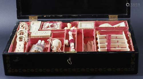 CHINESE BLACK LACQUERED GAMES BOX AND CONTENTS, 19th century, with gilt foliate decoration, the