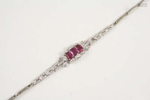 AN ART DECO RUBY AND DIAMOND BRACELET the three oval-shaped rubies are mounted top and bottom with