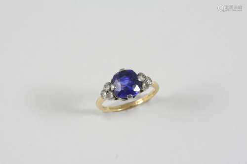 A SAPPHIRE AND DIAMOND RING the cushion-shaped sapphire is set with three old brilliant-cut diamonds