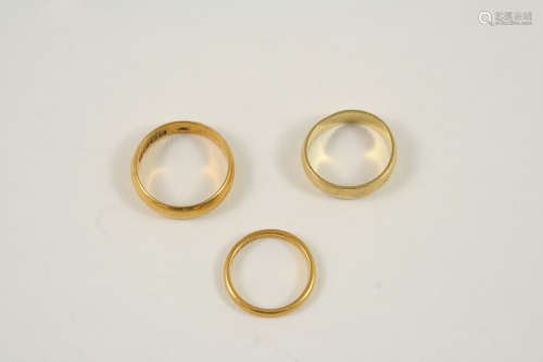A 22CT. GOLD WEDDING BAND 4.9 grams, size M, together with another 22ct. gold wedding band, 1.9