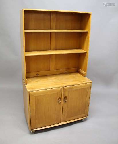 ERCOL BOOKCASE a light coloured elm bookcase from the Windsor Range, the top section with two