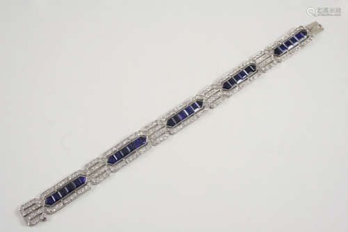 AN ART DECO SAPPHIRE AND DIAMOND BRACELET formed as five panels each centred with calibre-cut